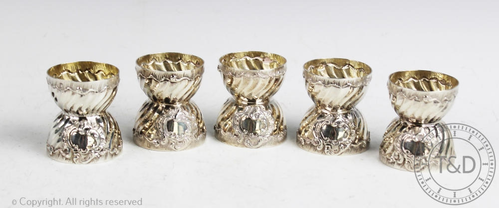 A set of five continental silver egg cups of Rococo style, possibly Austrian, makers mark 'PW',