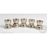 A set of five continental silver egg cups of Rococo style, possibly Austrian, makers mark 'PW',