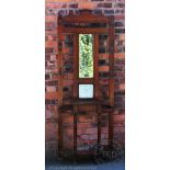 An Edwardian walnut hall stand, with mirror and tile back,