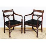 A pair of Victorian Regency style mahogany carver chairs, with upholstered seats,