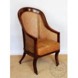 A Regency mahogany caned tub chair, on sabre legs, 106.