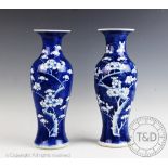An associated pair of Chinese porcelain blue and white Prunus pattern vases, early 20th century,