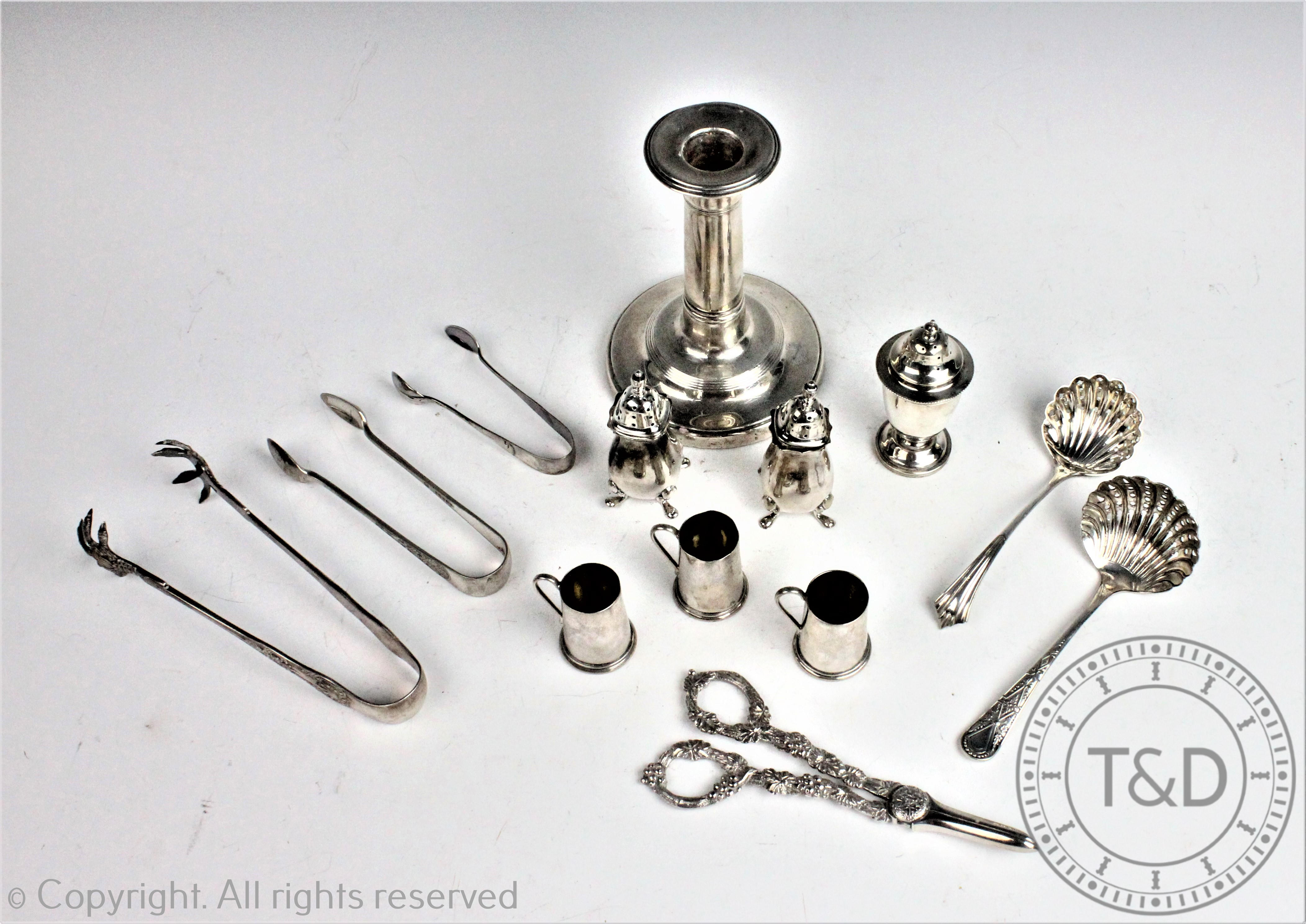 A selection of silver and plated wares, to include; a silver candlestick Birmingham 1902, 13.