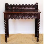 A Victorian carved oak hall table, with drawer, on bobbin turned legs, 93.5cm H x 89cm W x 41.
