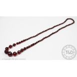 A cherry amber coloured faceted bead necklace,