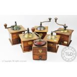 Six Peugeot Freres wooden coffee grinders with cast iron mounts,