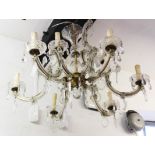 A French nine light glass chandelier and a pair of wall lights,