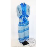 A ladies afternoon princess line dress, circa 1880s, the blue striped silk taffeta dress,