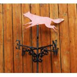 A cast and wrought iron weather vane, modelled with a fox, 90cm H, mounted onto a long bracket,