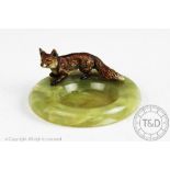 A cold painted bronze fox and onyx ashtray,