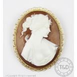 An Italian carved shell cameo brooch within 18ct gold mount,