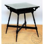An Aesthetic ebonised occasional table stamped 'Jas Shoolbred & Co', square top with frieze drawer,