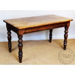 A Victorian style oak country kitchen table, with drawer, on turned legs,