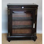 A Victorian ebonised pier cabinet, with glazed door enclosing shelves, on plinth base,