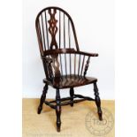 A modern stained beech Windsor type chair, with spindle back and solid seat, on turned legs,