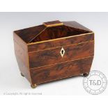 A George IV inlaid yew wood tea caddy, two divisions, on gilt metal ball feet,
