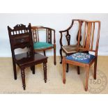 An Edwardian mahogany corner chair, with two other Edwardian chairs and a mahogany hall chair,