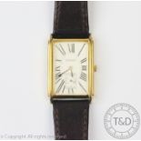 A Tissot wristwatch, the yellow metal rectangular case enclosing rectangular face,