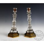 A pair of 19th century ormolu and cut glass candlesticks,