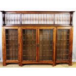An Arts and Crafts oak bookcase in the manner of Shapland and Petter, of large proportions,