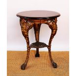 A cast iron Britannia pub table, with circular stained wood top,