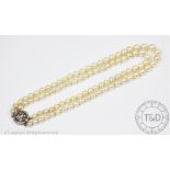 A cultured pearl necklace with diamond set clasp,