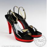 A pair of mid 20th century red plastic and black patent leather heeled sandals, by 'Vernon Humpage',