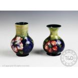 Two Moorcroft vases, decorated in a Clematis pattern,