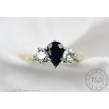 A sapphire and diamond three stone ring,