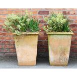 A pair of tall terracotta garden planters, of tapered square form,