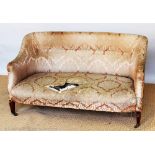 An Edwardian mahogany salon settee and two tub chair, on tapered legs,