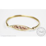 A 9ct yellow gold Clogau bangle,