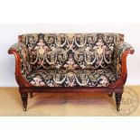 An early 19th century carved rosewood scroll end settee / day bed, on carved and turned legs,