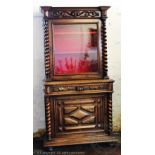 A 19th century French walnut cabinet, with glazed door enclosing shelves,
