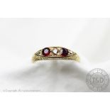 An Edwardian ruby coloured and diamond five stone ring, Birmingham 1907,
