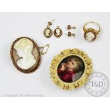 A carved shell cameo brooch in 9ct yellow gold surround,