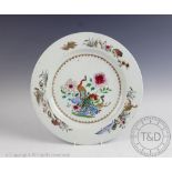 A 19th century Chinese famille rose export porcelain plate, decorated with a peacock, peahen,
