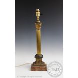 An Edwardian gilt metal and marble lamp, modelled as a fluted Corinthian column,