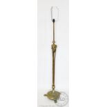 An Edwardian brass adjustable standard lamp in the Adam style,