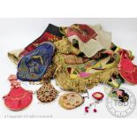 An elaborately beaded purse, decorated with a beaded paisley type design,