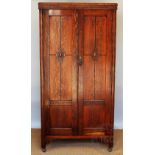 An early 20th century oak wardrobe / hall cupboard, with two doors,