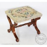 A Victorian carved walnut 'X' frame stool, with tapestry seat,