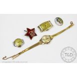 A ladies Omega Seamaster wristwatch, the yellow metal circular case enclosing baton dial,
