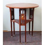 An Arts and Crafts type mahogany circular occasional table,