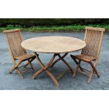 A modern folding garden table and six chairs, the table 132cm diam (approx),