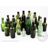 A collection of 19th century and later vintage beer and drink glass bottles,