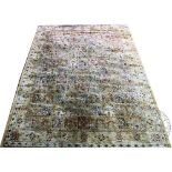 A Kashmir garden design carpet, worked with 108 foliate squares against a pale ground,
