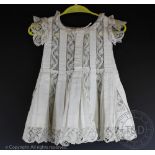A childs cotton pique dress, early 20th century, with crochet inserts,