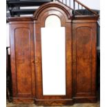 A Victorian burr walnut dome top triple wardrobe,