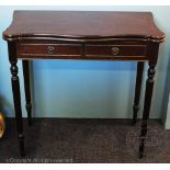 A reproduction mahogany card table, with serpentine top and two faux drawers, on tapered legs,